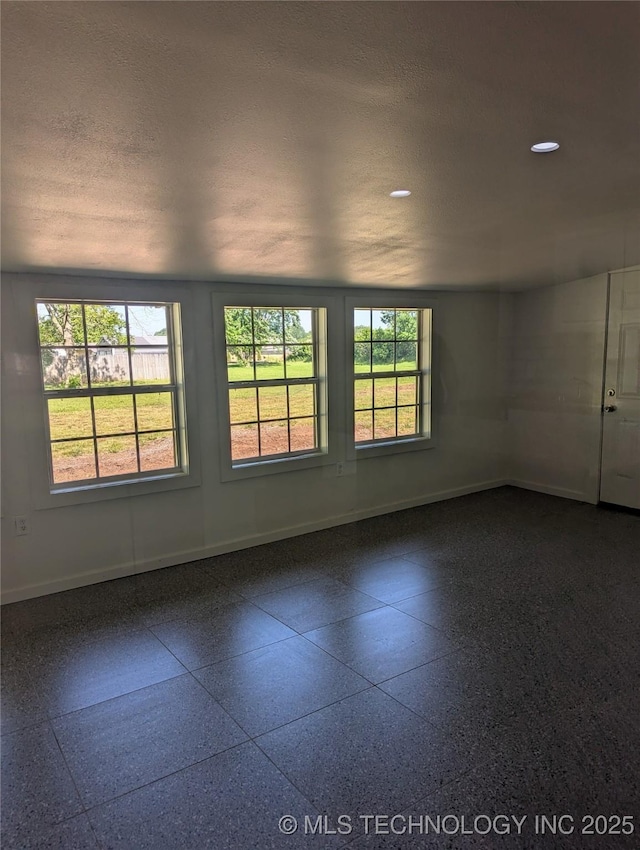 9533 E 136th St, Bixby, OK 74008 - empty room with baseboards, recessed lighting, and light speckled floor