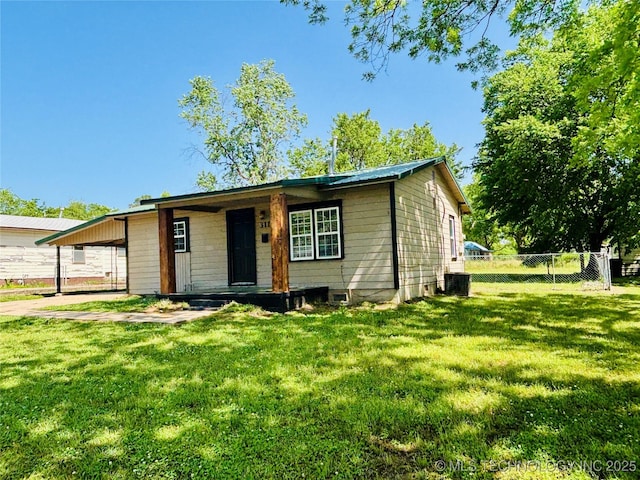 view of front of home with central air condition unit and a carport