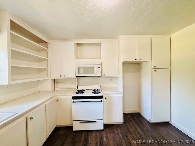 kitchen featuring open shelves, white appliances, dark wood-type flooring, baseboards, and white cabinetry