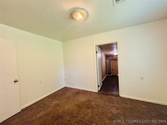 spare room with carpet flooring and baseboards