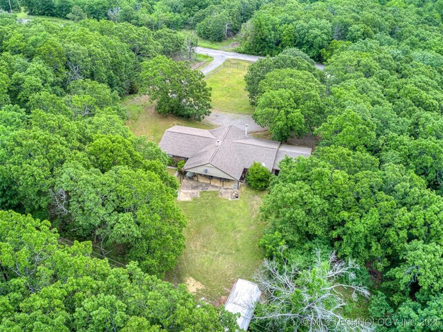 6551 S 41st St E, Muskogee, OK 74403 - aerial overview of property's location with a heavily wooded area