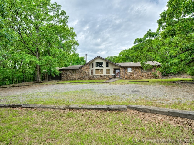 6551 S 41st St E, Muskogee, OK 74403 - view of front facade with stone siding and a front lawn