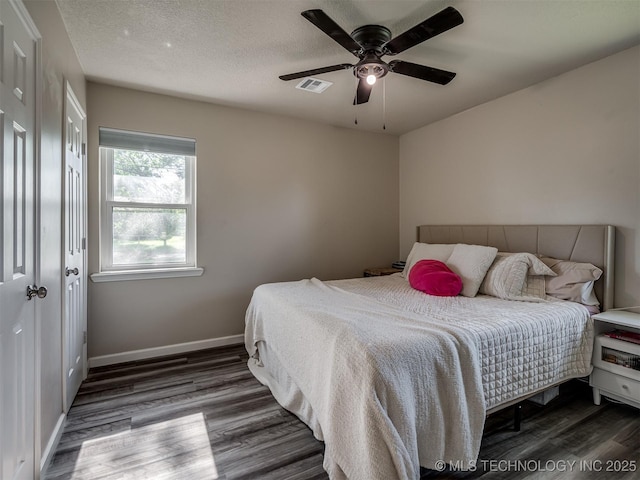1149 N Hickory Pl, Broken Arrow, OK 74012 - bedroom with wood finished floors, baseboards, ceiling fan, and a textured ceiling