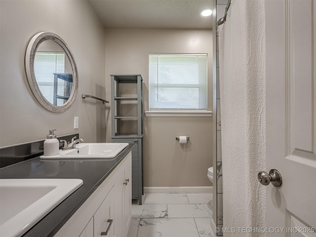 1149 N Hickory Pl, Broken Arrow, OK 74012 - full bathroom featuring marble finish floors, healthy amount of natural light, toilet, and baseboards