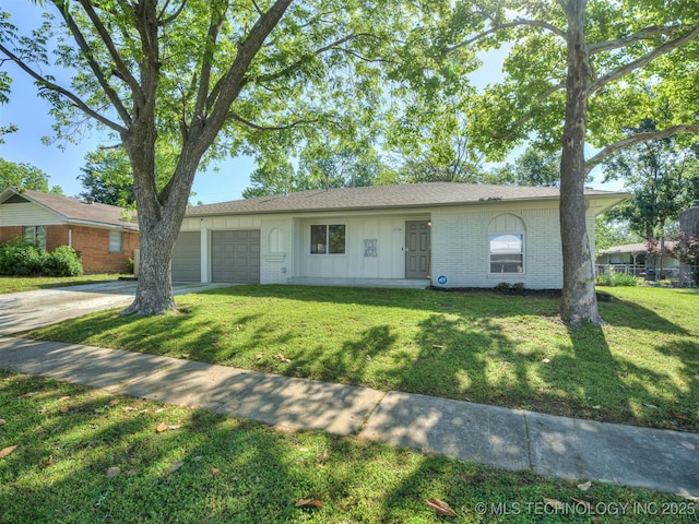 1149 N Hickory Pl, Broken Arrow, OK 74012 - ranch-style house with a garage, brick siding, a front yard, and driveway