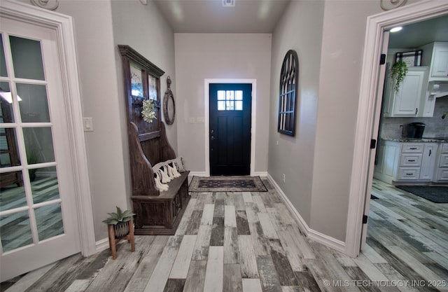 110 W Zachry Ln, Stigler, OK 74462 - entrance foyer featuring light wood-type flooring and baseboards