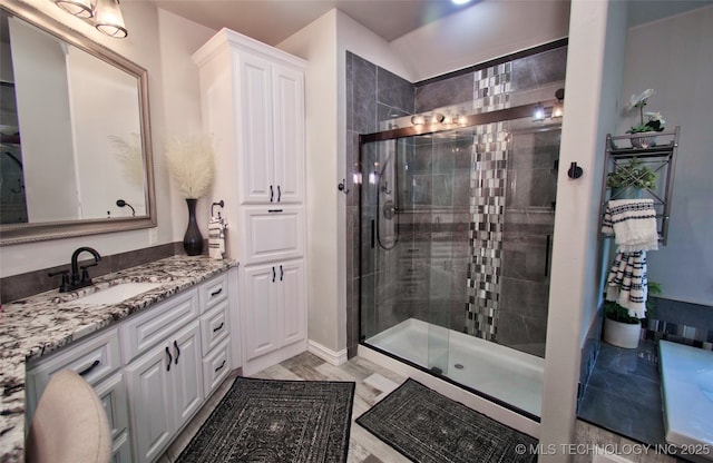 110 W Zachry Ln, Stigler, OK 74462 - full bath featuring a stall shower, vanity, and baseboards