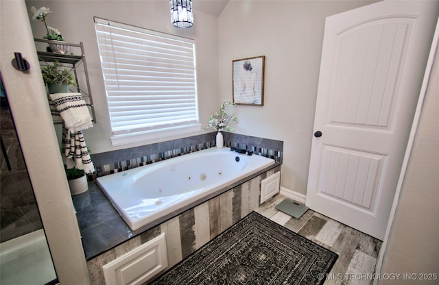 110 W Zachry Ln, Stigler, OK 74462 - full bath with a whirlpool tub and wood finished floors