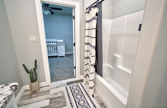110 W Zachry Ln, Stigler, OK 74462 - full bathroom featuring shower / tub combo, baseboards, a ceiling fan, and wood finished floors