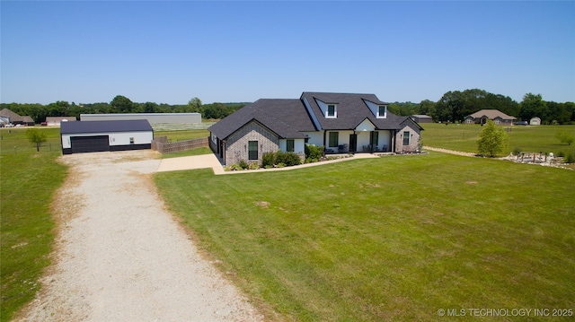 110 W Zachry Ln, Stigler, OK 74462 - view of front of home with gravel driveway, an outdoor structure, and a detached garage
