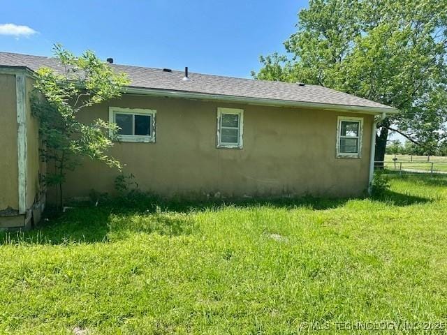 32767 S 4220th Rd, Inola, OK 74036 - view of side of home featuring stucco siding and roof with shingles