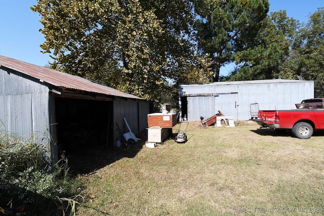 7457 S 105th St E, Braggs, OK 74423 - view of grassy yard featuring a pole building and an outbuilding
