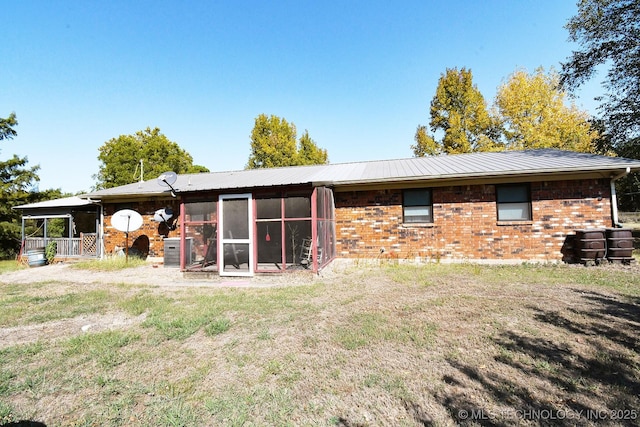 7457 S 105th St E, Braggs, OK 74423 - rear view of house featuring brick siding and a lawn