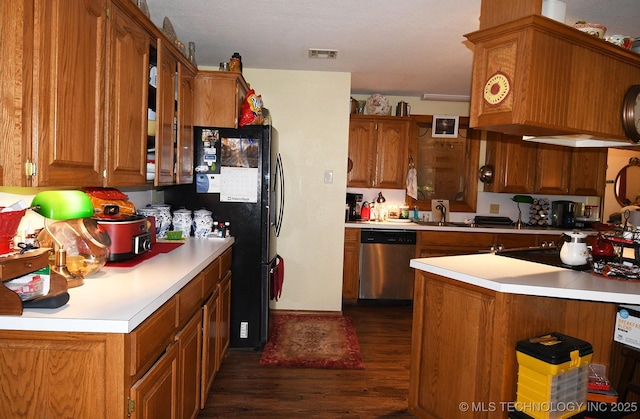 7457 S 105th St E, Braggs, OK 74423 - kitchen featuring dishwasher, dark wood finished floors, brown cabinetry, light countertops, and a sink