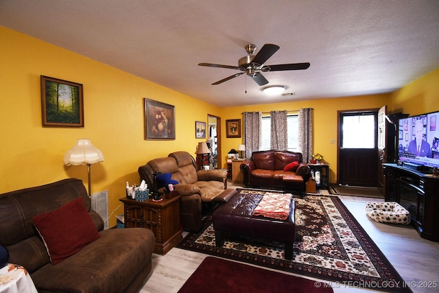7457 S 105th St E, Braggs, OK 74423 - living area with wood finished floors and ceiling fan