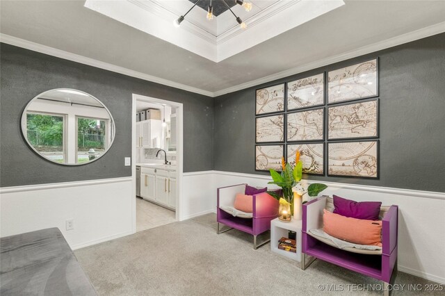 6315 E 98th Pl, Tulsa, OK 74137 - sitting room with ornamental molding, a raised ceiling, carpet, and a wainscoted wall