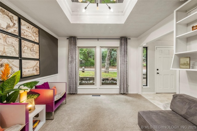 6315 E 98th Pl, Tulsa, OK 74137 - living area featuring crown molding, carpet, a tray ceiling, and a chandelier