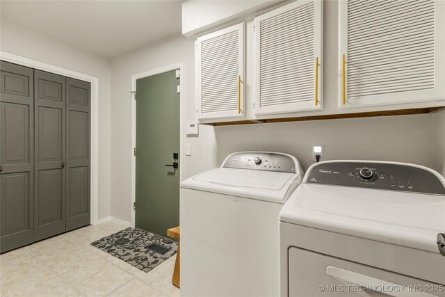 6315 E 98th Pl, Tulsa, OK 74137 - laundry room featuring cabinet space, independent washer and dryer, light tile patterned floors, and baseboards