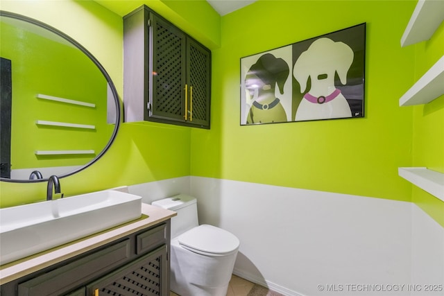 6315 E 98th Pl, Tulsa, OK 74137 - half bath featuring toilet, tile patterned floors, and vanity