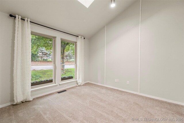 6315 E 98th Pl, Tulsa, OK 74137 - spare room with carpet floors, lofted ceiling, baseboards, and a skylight