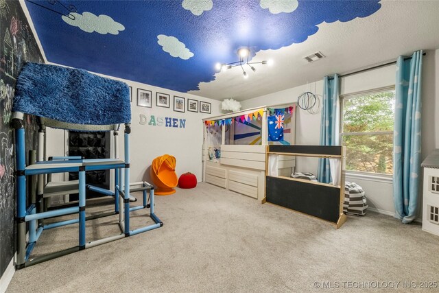 6315 E 98th Pl, Tulsa, OK 74137 - recreation room featuring carpet, a textured ceiling, and baseboards