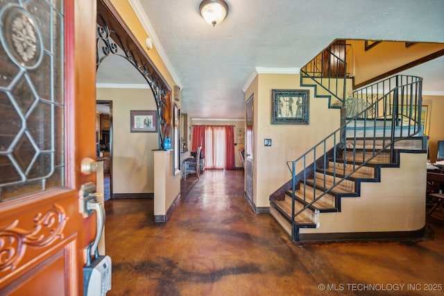 17711 E Archer St, Catoosa, OK 74015 - foyer entrance featuring stairway, baseboards, ornamental molding, concrete flooring, and a textured ceiling