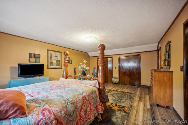 17711 E Archer St, Catoosa, OK 74015 - bedroom featuring wood finished floors and a textured ceiling