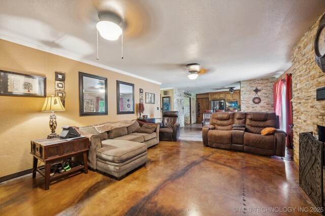 17711 E Archer St, Catoosa, OK 74015 - living area with ceiling fan, concrete floors, a fireplace, crown molding, and a textured ceiling