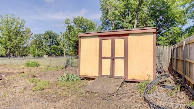view of shed with a fenced backyard