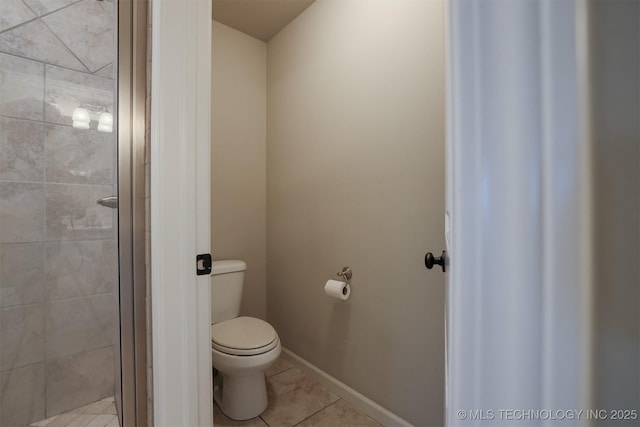 4314 S 132nd E Ave, Tulsa, OK 74134 - full bath with toilet, a stall shower, tile patterned flooring, and baseboards