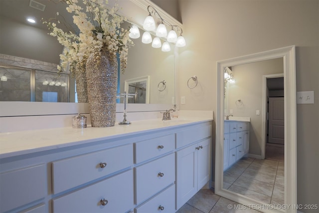 4314 S 132nd E Ave, Tulsa, OK 74134 - bathroom featuring a shower stall, vanity, and tile patterned floors