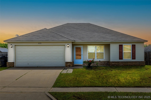view of front of home with brick siding, concrete driveway, a front lawn, and an attached garage
