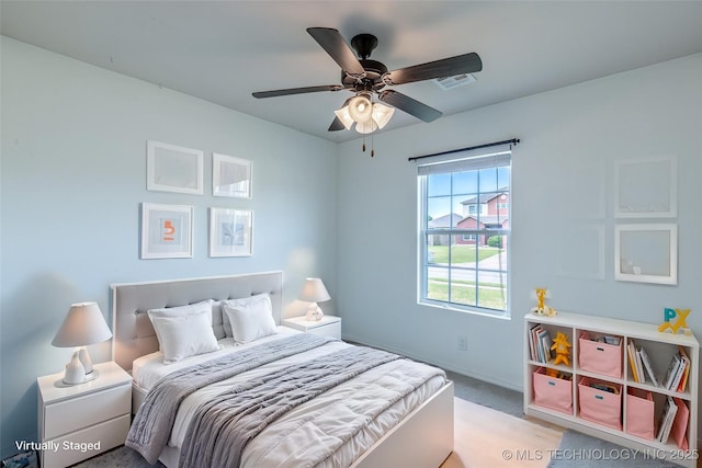 bedroom featuring baseboards, ceiling fan, and carpet flooring