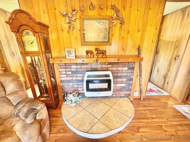 30190 W County Road 1240, Stigler, OK 74462 - living area with heating unit, wood walls, and light wood finished floors