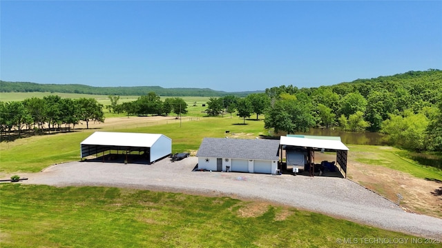 30190 W County Road 1240, Stigler, OK 74462 - surrounding community featuring a carport, a rural view, driveway, a yard, and an outdoor structure