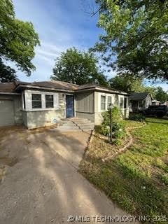 3527 S Knoxville Ave, Tulsa, OK 74135 - ranch-style home with driveway and a garage