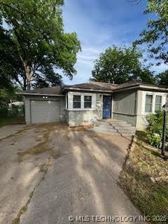 3527 S Knoxville Ave, Tulsa, OK 74135 - view of front of home with driveway and a garage