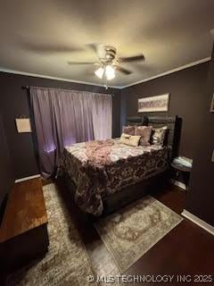 3527 S Knoxville Ave, Tulsa, OK 74135 - bedroom with baseboards, dark wood finished floors, and a ceiling fan