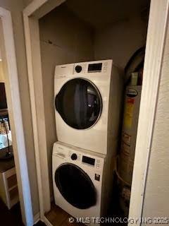 3527 S Knoxville Ave, Tulsa, OK 74135 - laundry room featuring stacked washing machine and dryer
