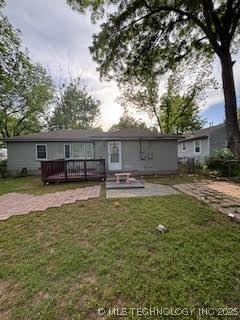3527 S Knoxville Ave, Tulsa, OK 74135 - rear view of property featuring a deck, a yard, and a patio area