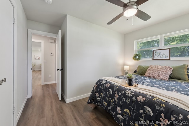 425 Mulberry Ave, Afton, OK 74331 - bedroom with wood finished floors, baseboards, and a ceiling fan