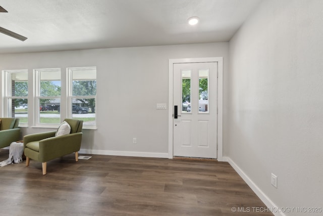 425 Mulberry Ave, Afton, OK 74331 - entryway with dark wood-type flooring, baseboards, and ceiling fan