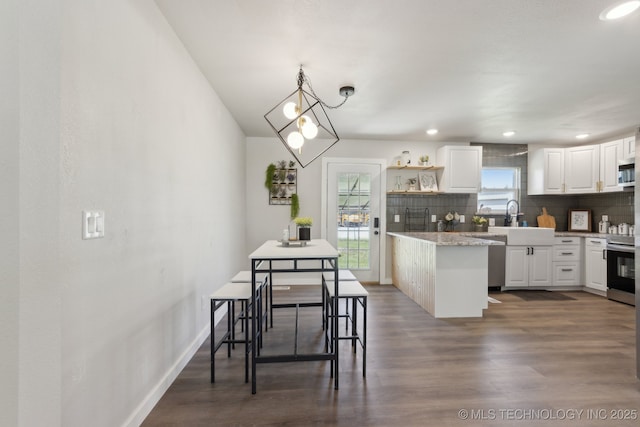 425 Mulberry Ave, Afton, OK 74331 - kitchen with appliances with stainless steel finishes, decorative backsplash, white cabinets, a sink, and open shelves