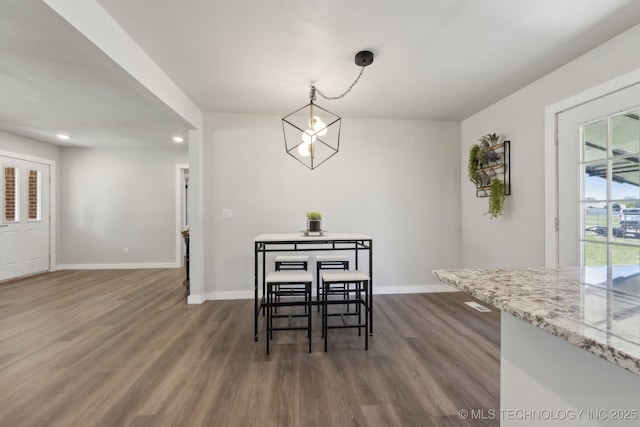 425 Mulberry Ave, Afton, OK 74331 - dining space with dark wood finished floors, baseboards, and recessed lighting