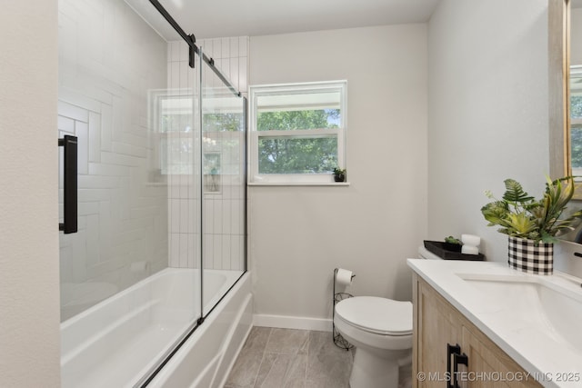 425 Mulberry Ave, Afton, OK 74331 - bathroom featuring vanity, toilet, combined bath / shower with glass door, baseboards, and marble finish floors
