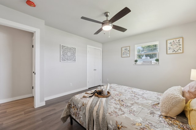 425 Mulberry Ave, Afton, OK 74331 - bedroom with baseboards, dark wood finished floors, a closet, and a ceiling fan