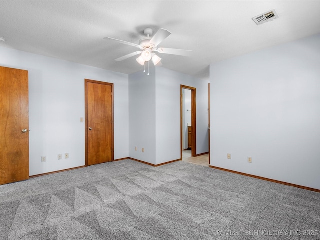 1044 Meadow Dr, Bartlesville, OK 74006 - unfurnished room featuring ceiling fan, light colored carpet, and baseboards