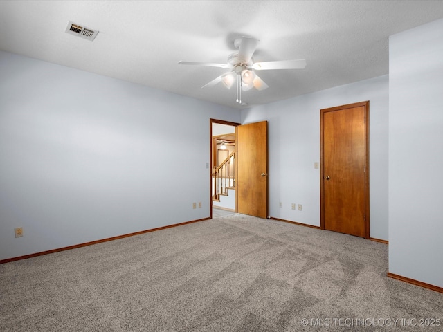 1044 Meadow Dr, Bartlesville, OK 74006 - carpeted empty room with ceiling fan and baseboards