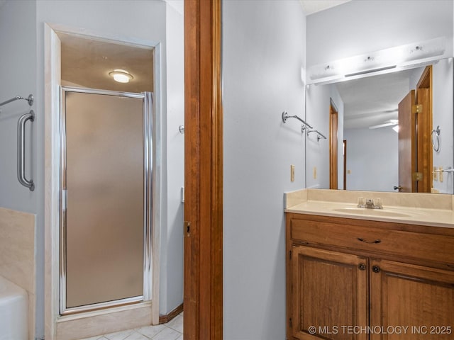 1044 Meadow Dr, Bartlesville, OK 74006 - bathroom featuring a stall shower, vanity, tile patterned floors, and a tub