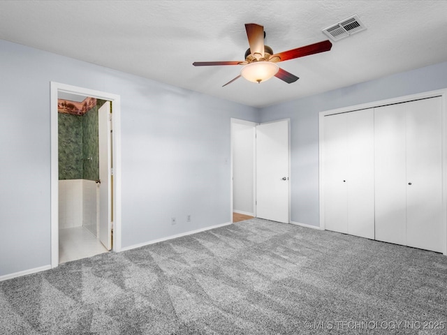 1044 Meadow Dr, Bartlesville, OK 74006 - unfurnished bedroom featuring carpet, baseboards, a closet, and a ceiling fan